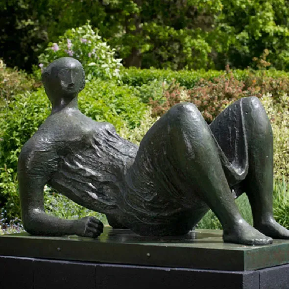 Henry Moore sculpture of a draped, reclining figure in a park setting